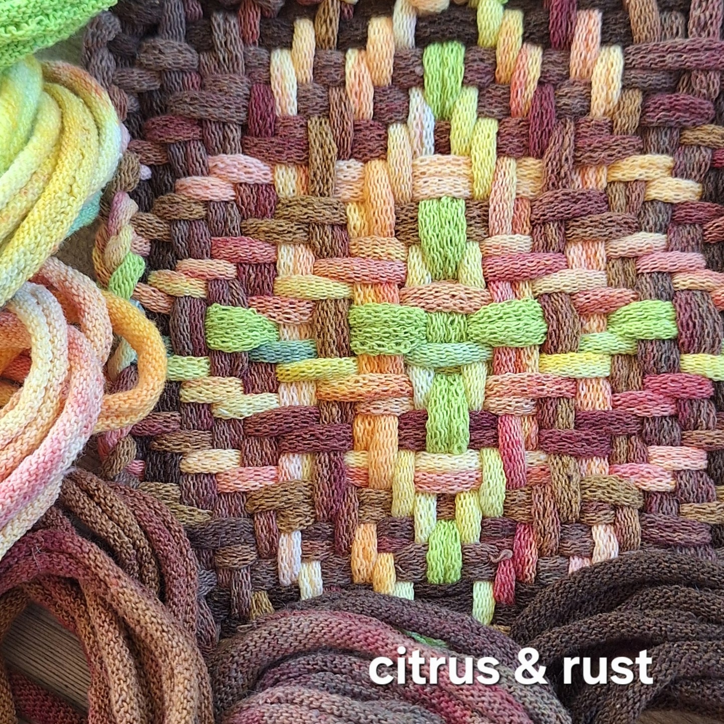 Citrus and rust potholder in the chunky star pattern