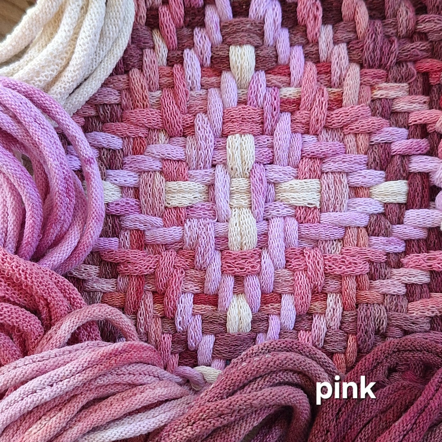pink woven potholder in the chunky star pattern