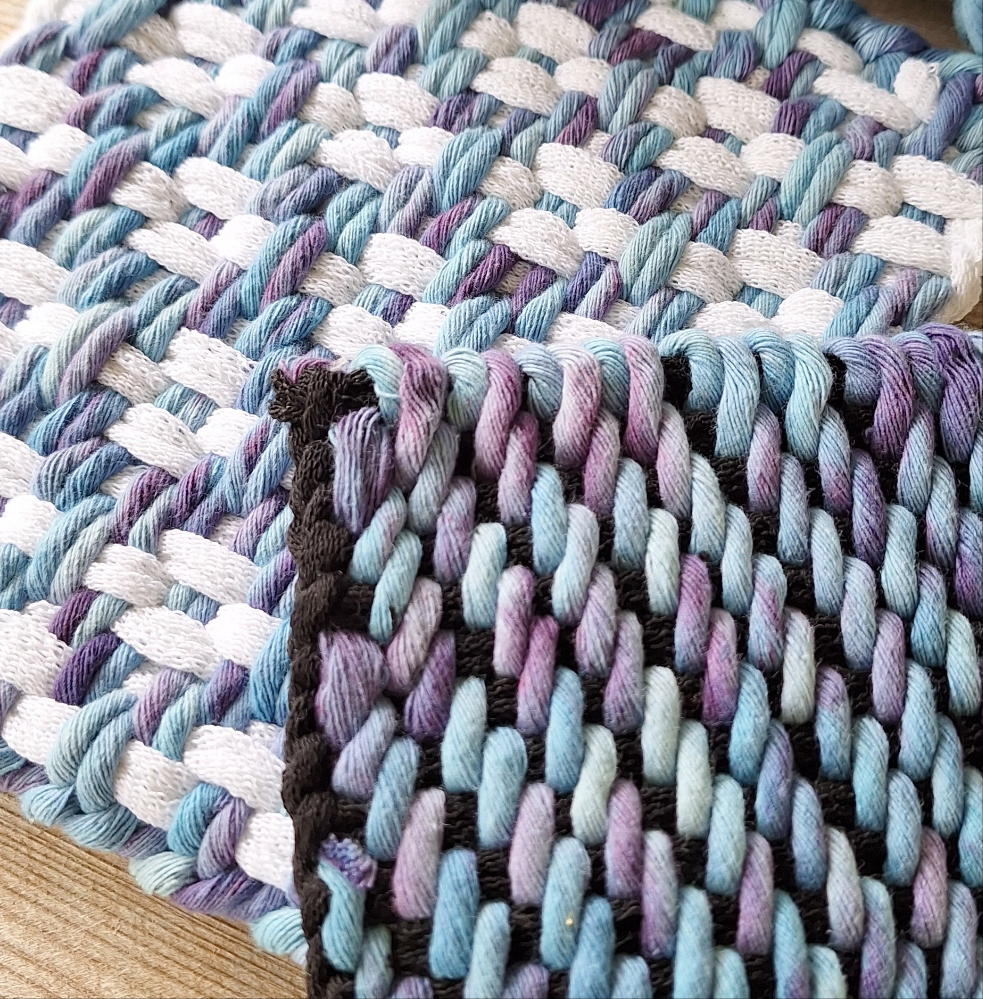Close-up of potholders woven with hand dyed soft cotton cord
