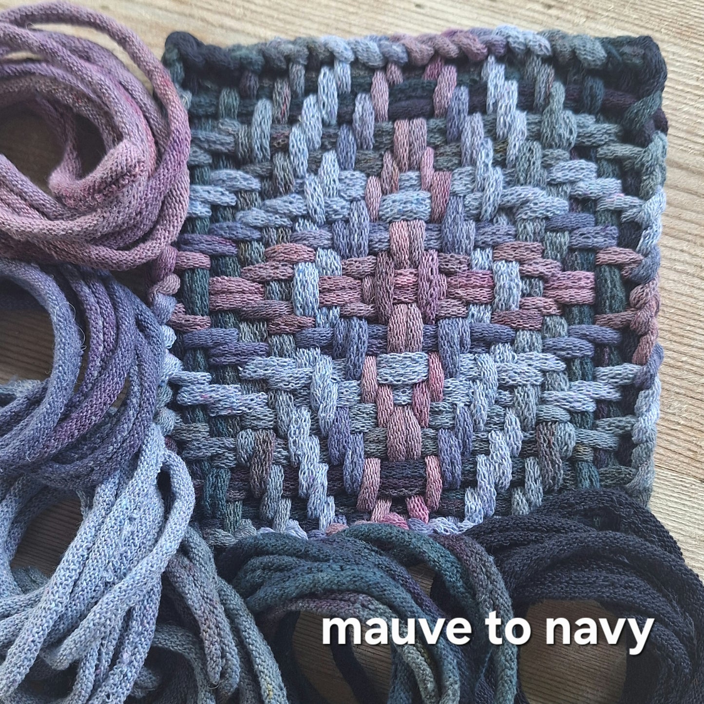 Chunky Star woven potholder with handy dyed loops showing color transition from mauve to navy on a wooden surface.