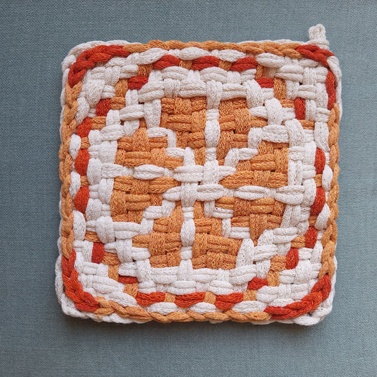 Double Weave potholder with an orange slice graphic design