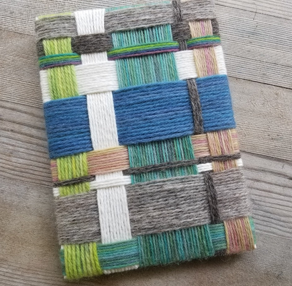 Weaving with a geometric pattern on a wooden surface