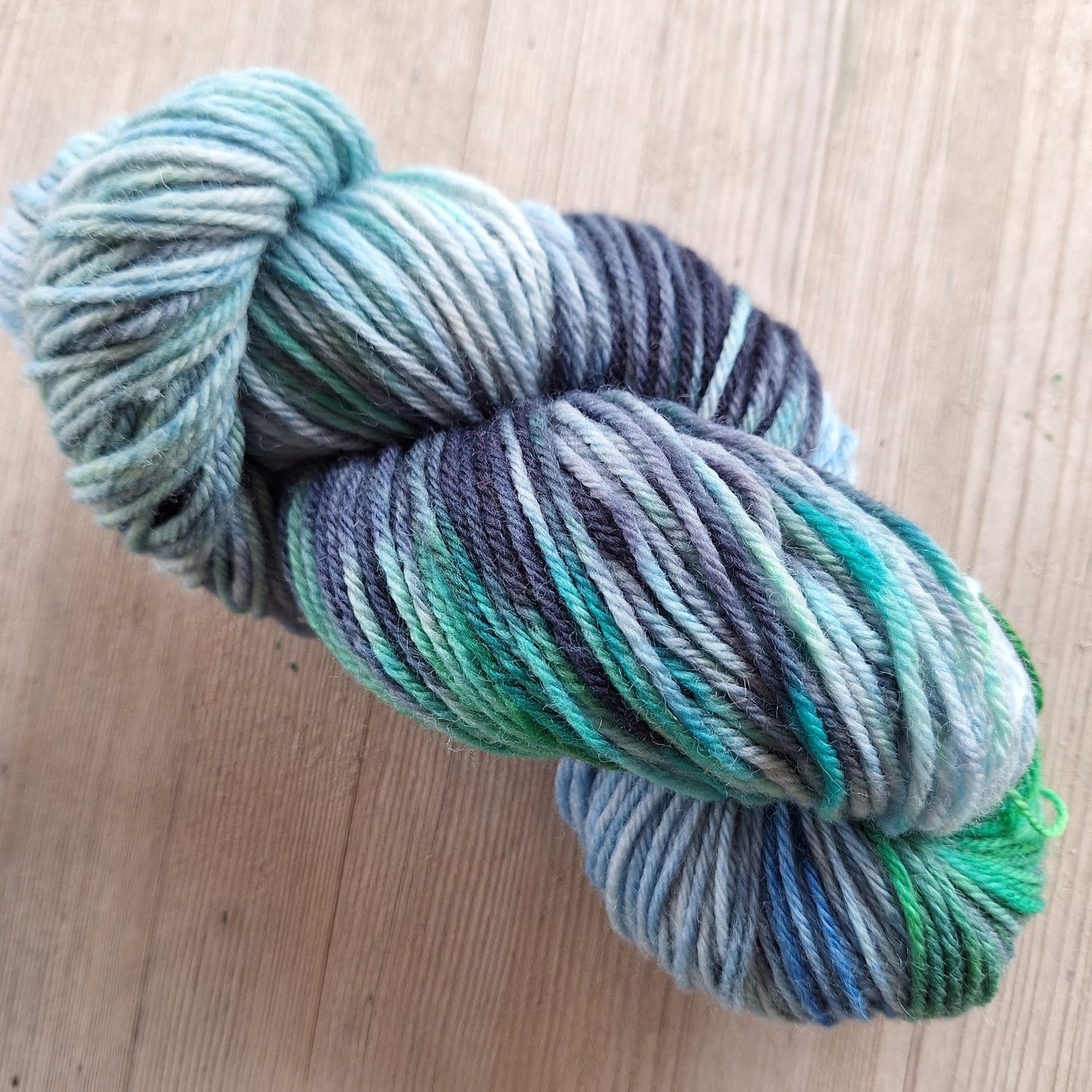 Light blue yarn with green and navy pops