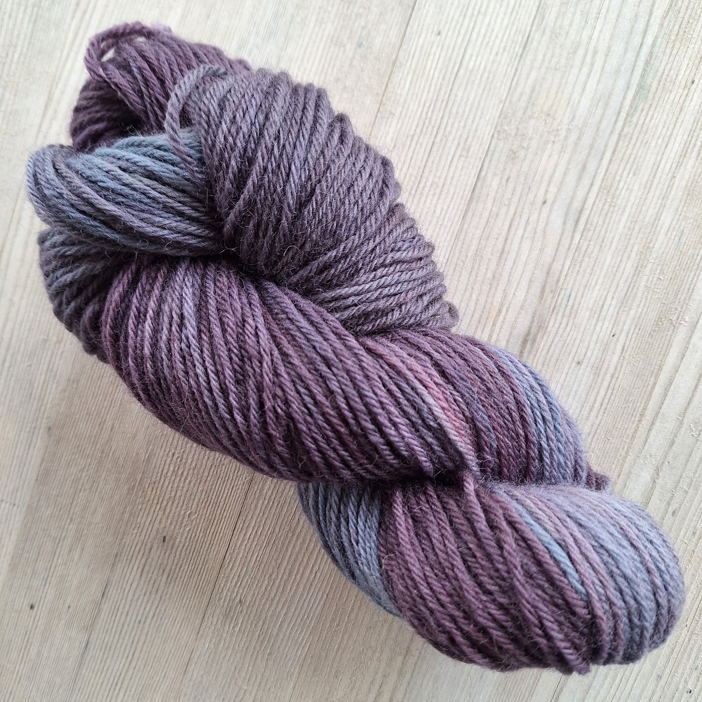 Deep purple and blue/grey yarn
