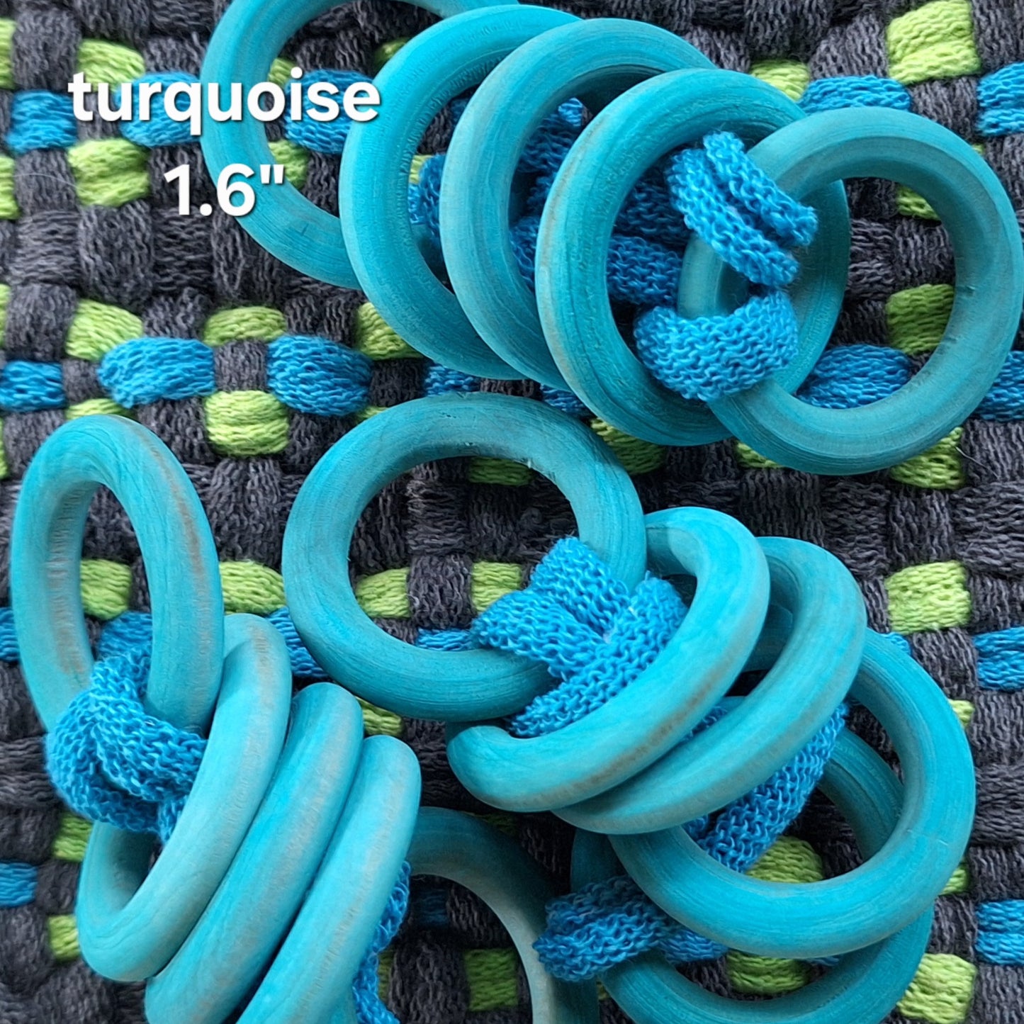 sets of blue wooden rings on a woven potholder