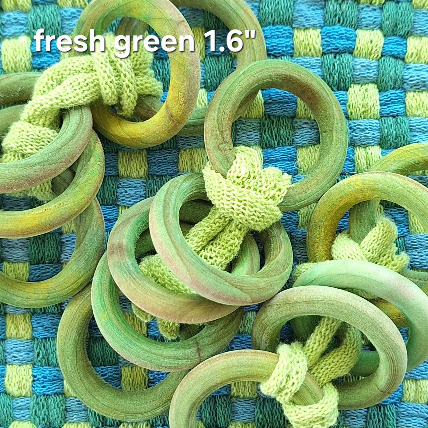 sets of green wooden potholder rings