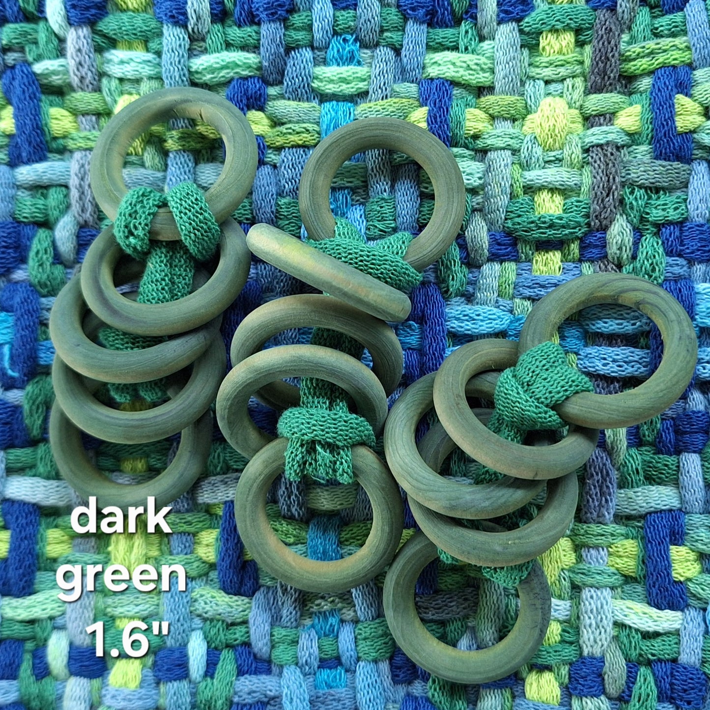 green wooden potholder rings