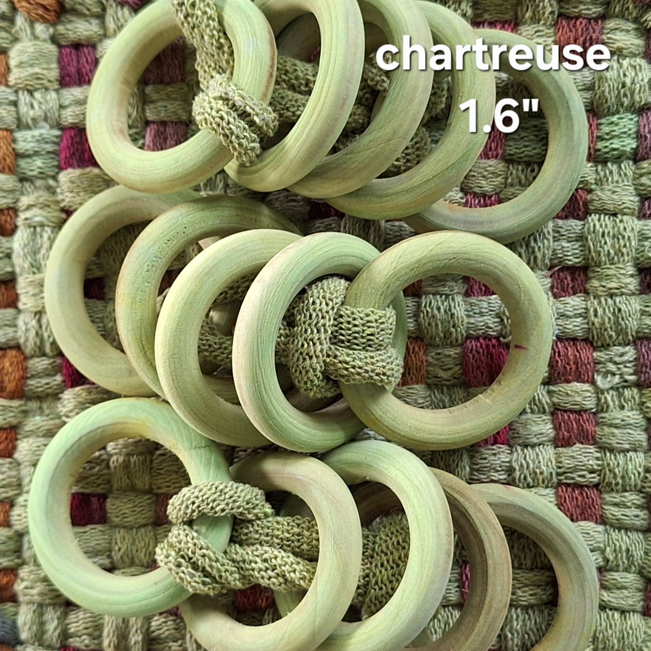 green wooden potholder rings