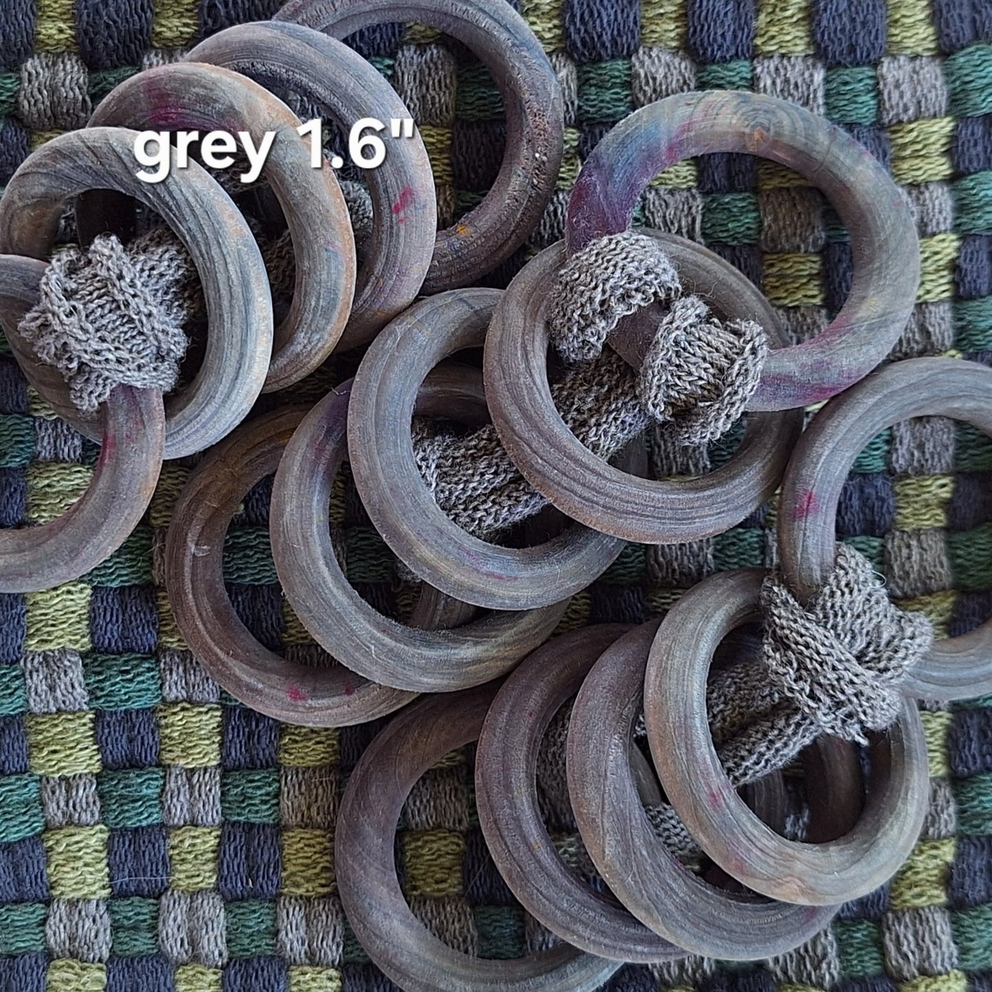 sets of grey wooden potholder rings