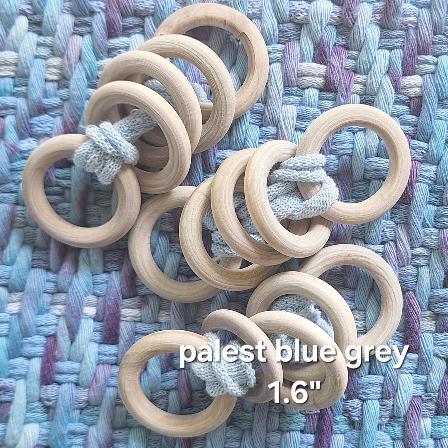 sets of pale grey wooden potholder rings