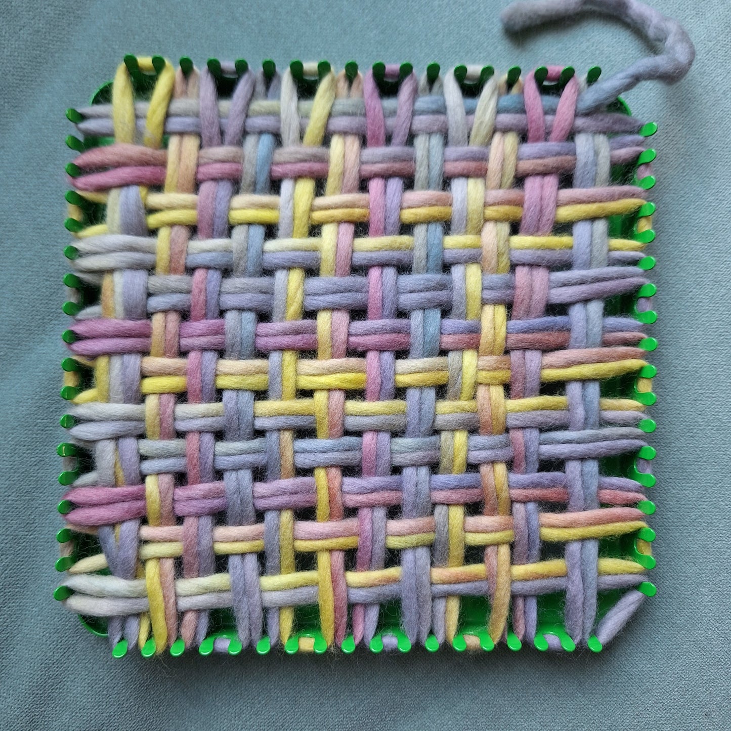 pencil roving woven on a potholder loom