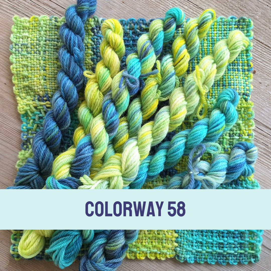 Color swatch with blue and green yarn on a wooden surface, labeled 'Colorway 58'.