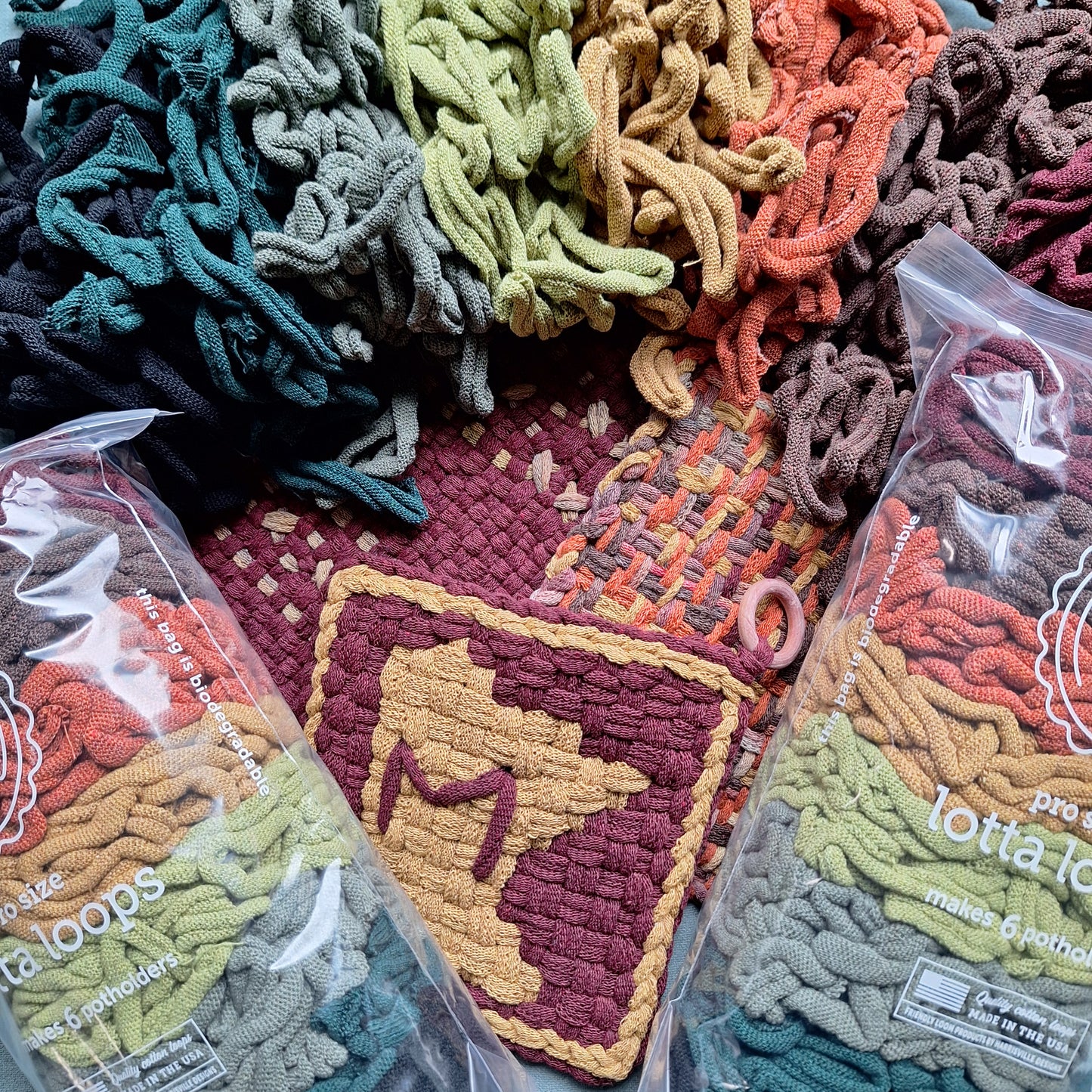 Pro size lotta loops packs in the Earthtones colorway and sample weavings