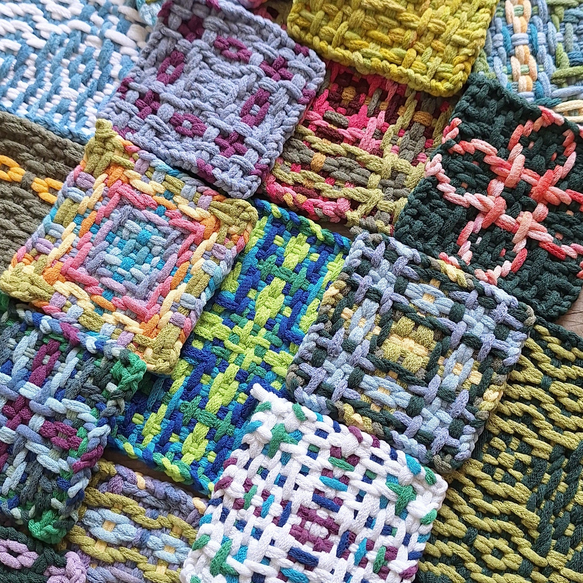 A collection of variations of the Chunky Daisy Chain potholder weaving pattern