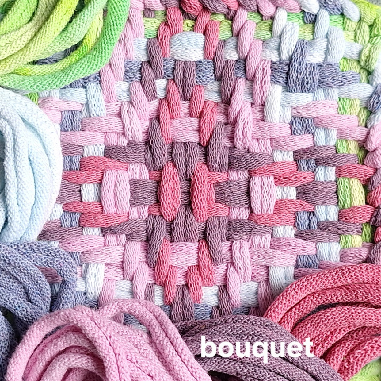 Close-up of woven textile with colorful potholder loops