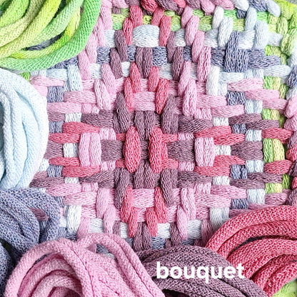 Close-up of woven textile with colorful potholder loops