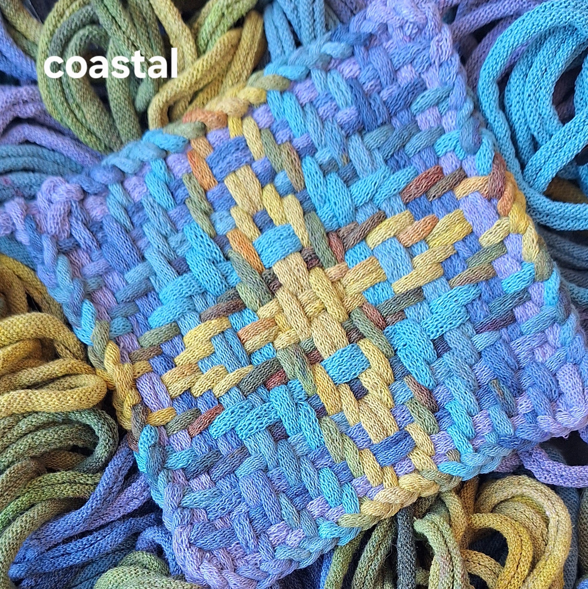 chunky star handwoven potholder in a blue and green colorway