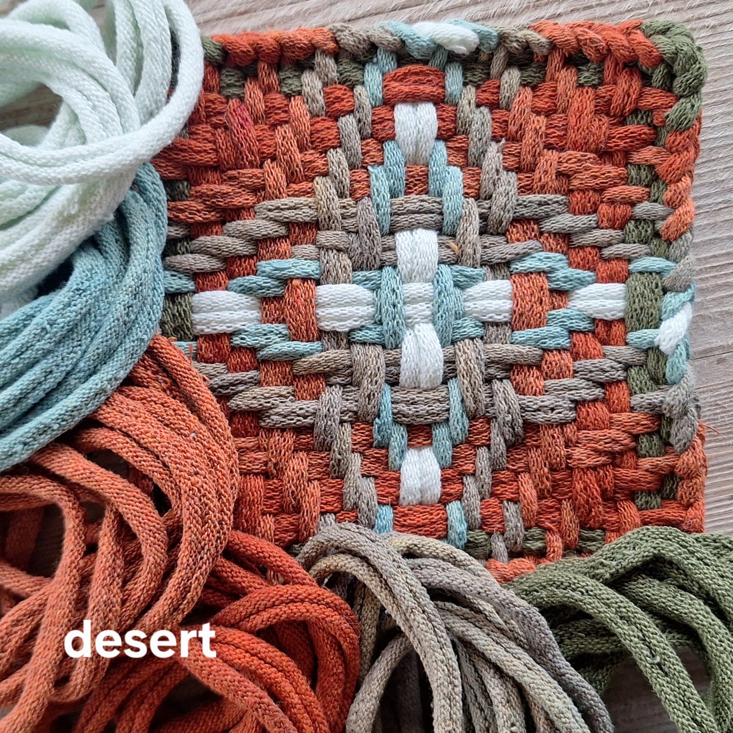 handwoven potholder  in spice, neutral, and light blue