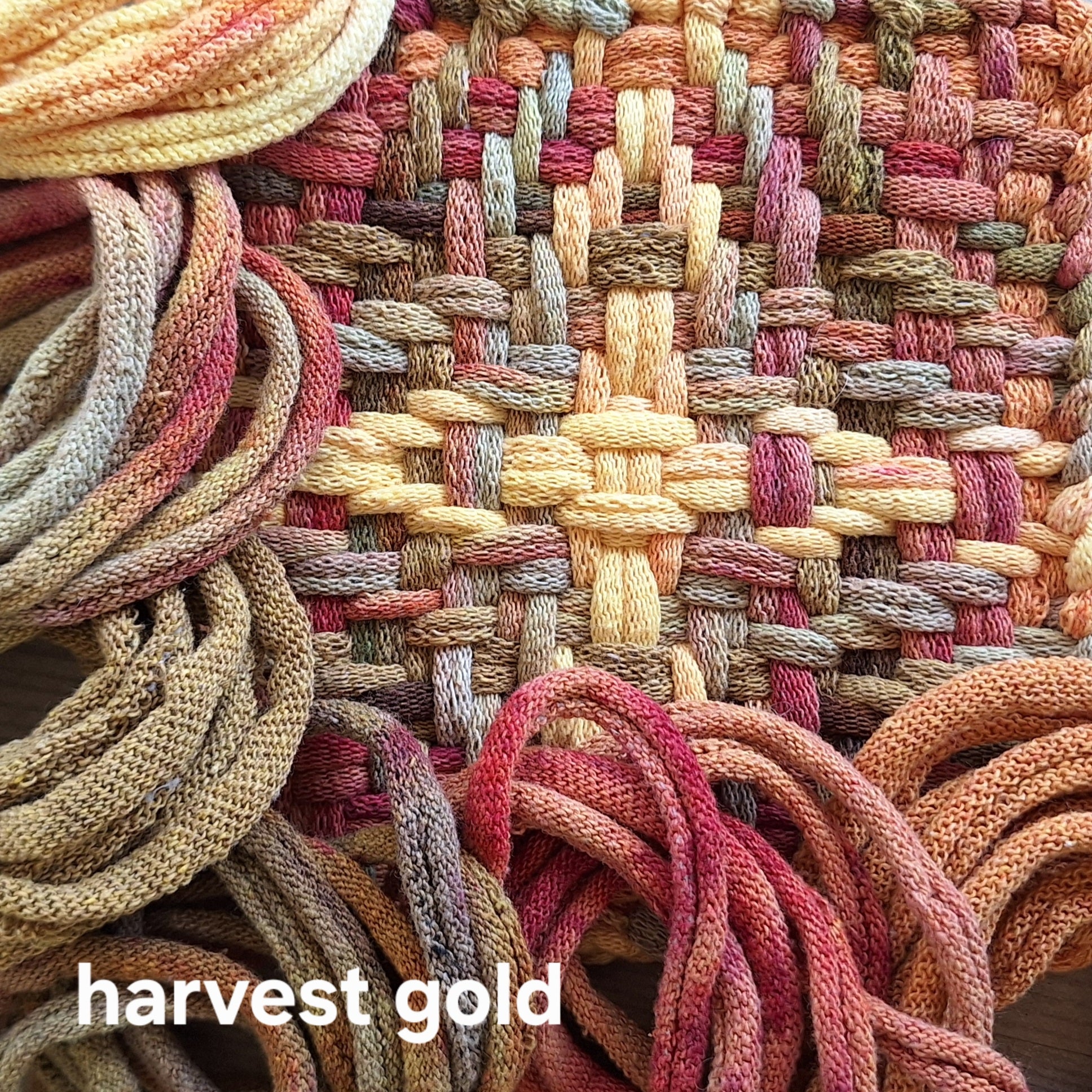 Close-up of woven potholder with 'harvest gold' text