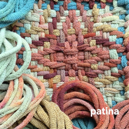Close-up of woven textile with colorful loops and 'patina' colorway name.
