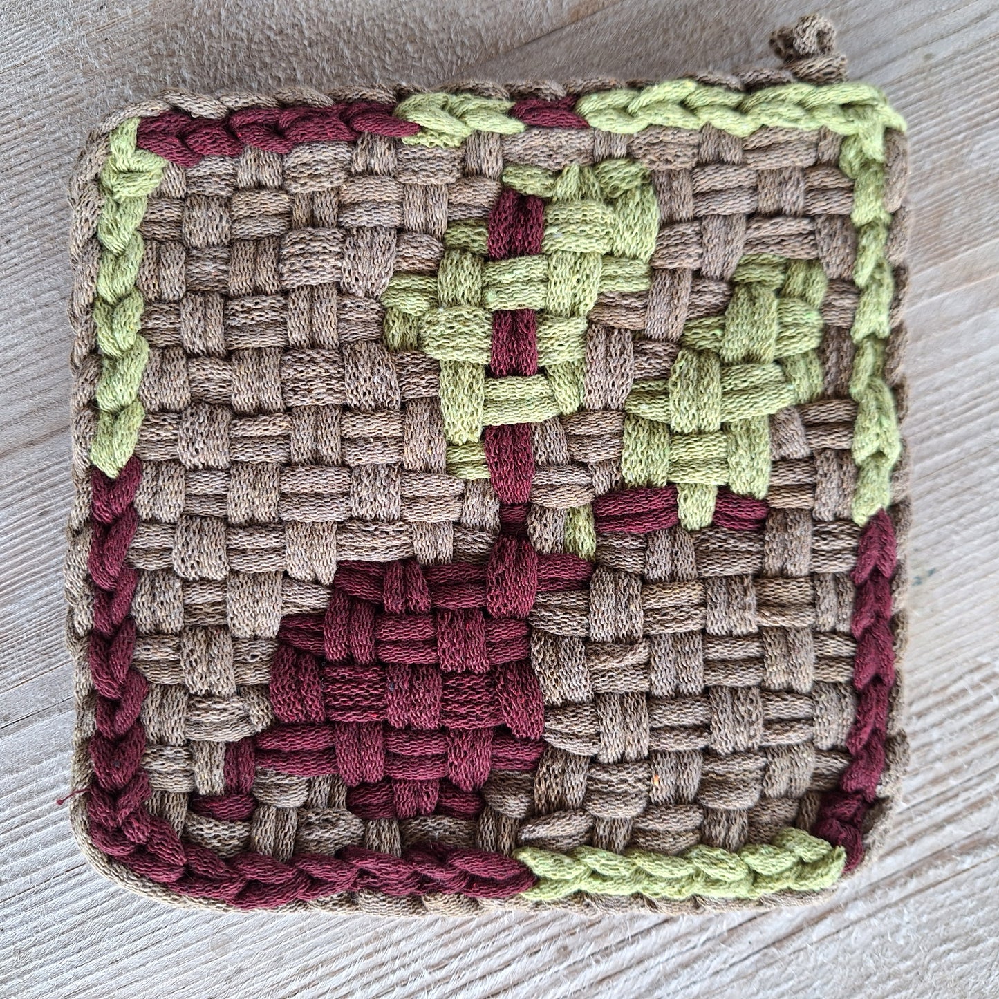 double weave potholder with a red beet design