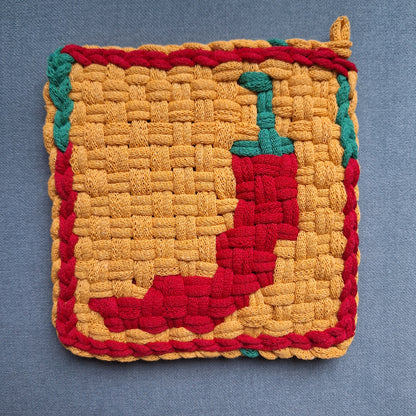 handwoven potholder with a red chili pepper image