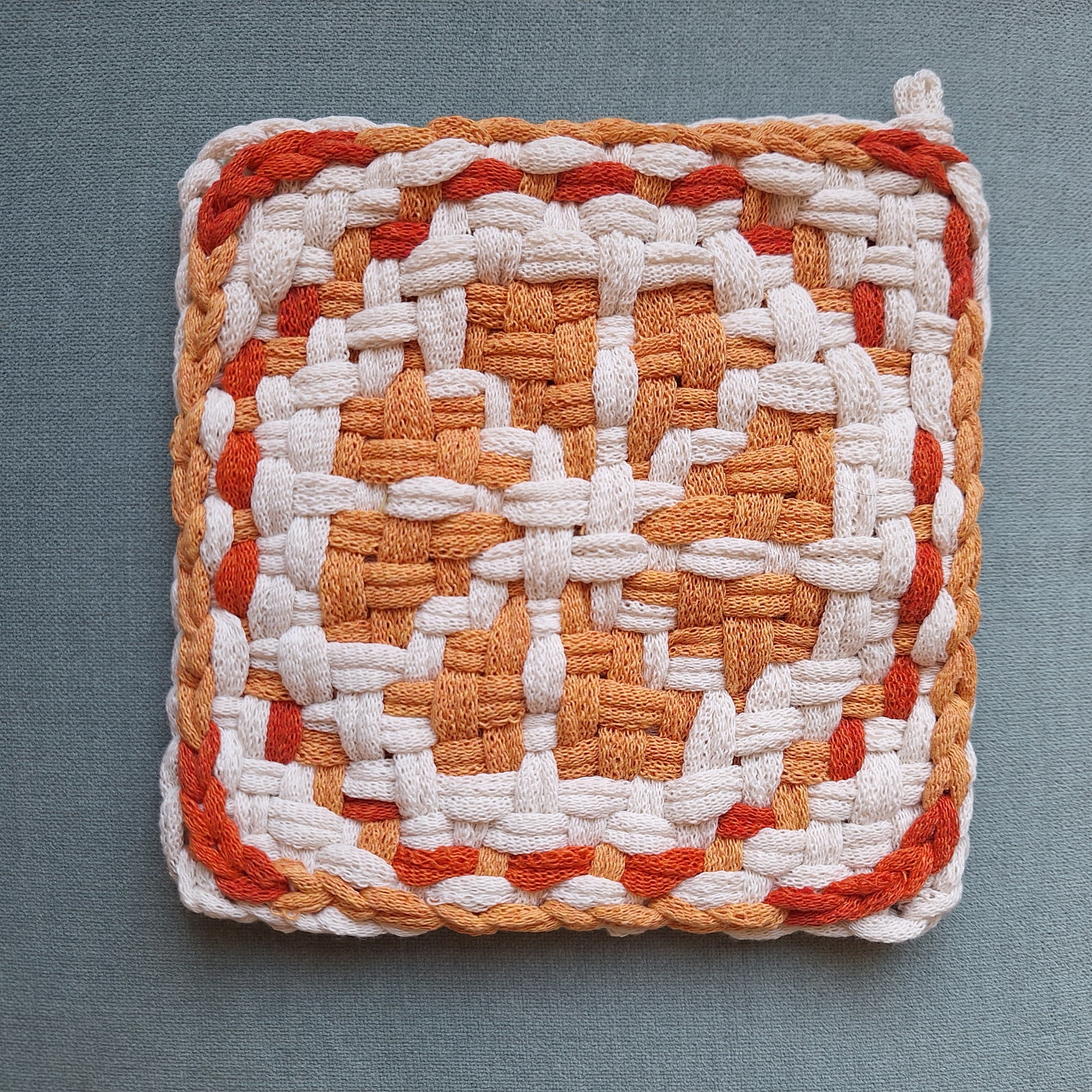 Double Weave potholder with an orange slice graphic design