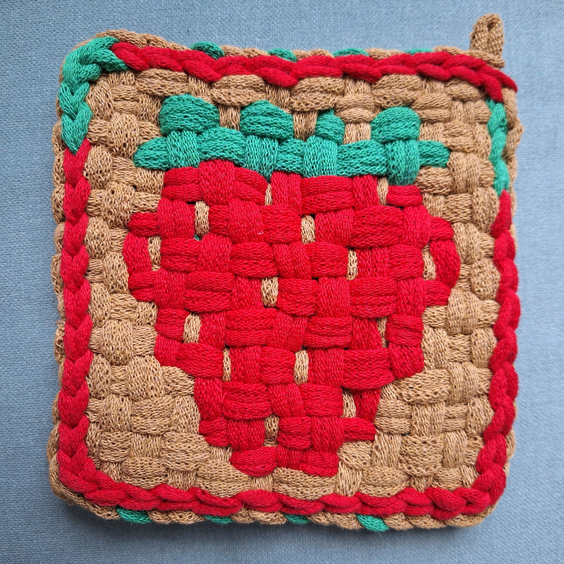 handwoven potholder depicting  strawberry design