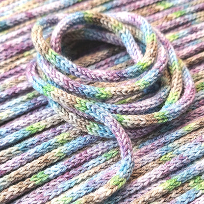 Close-up of multicolored wool i-cord in pastel shades.