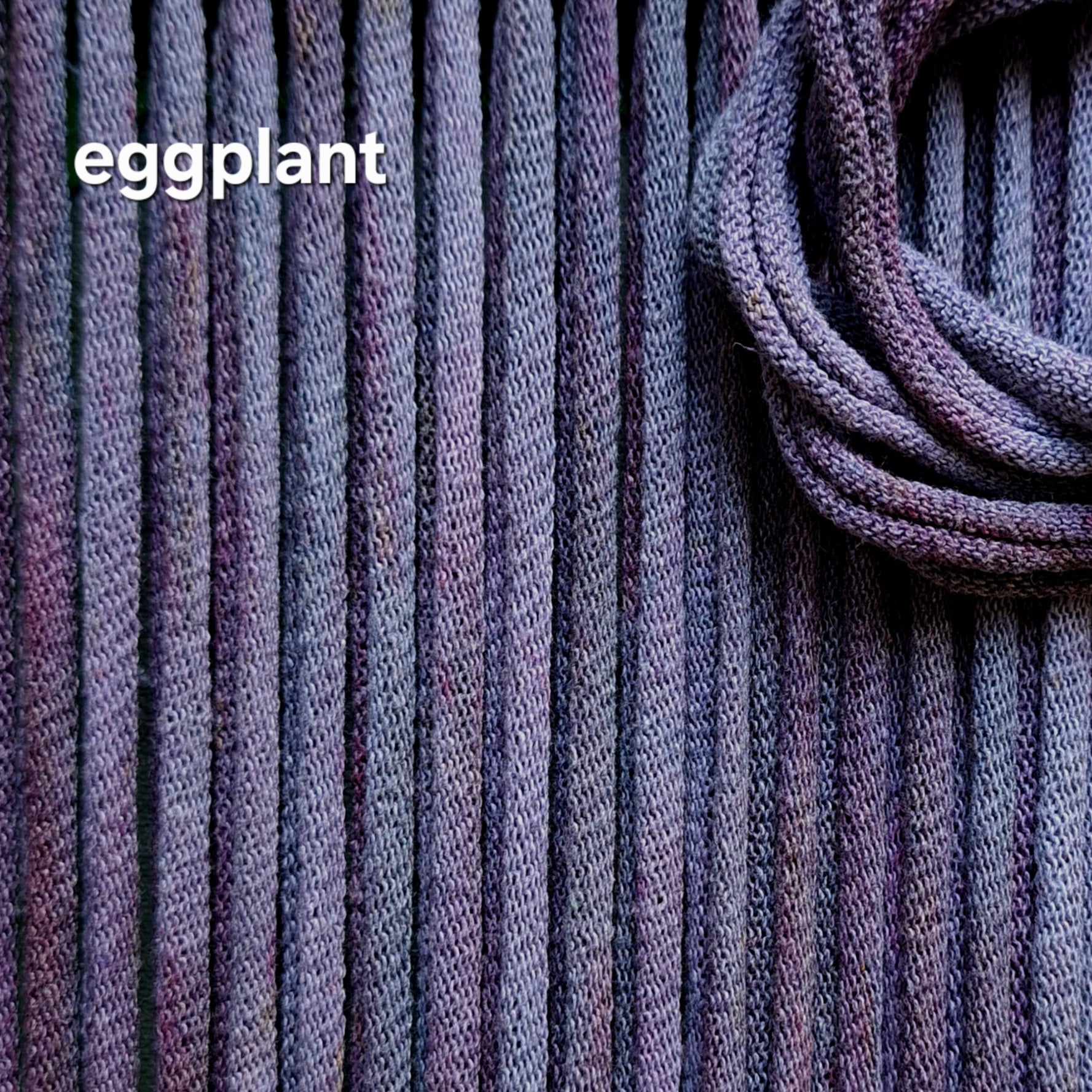 Close-up of eggplant colored hand dyed potholder loops