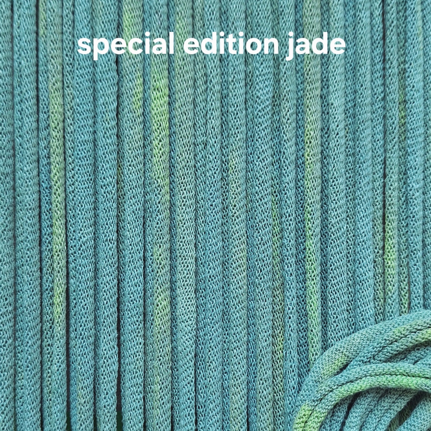 Close-up of teal potholder loops with 'special edition jade' text