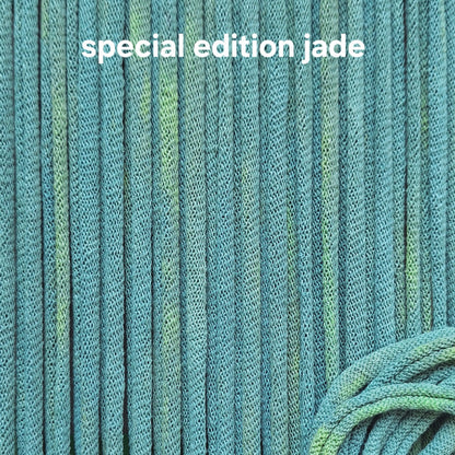 Close-up of teal potholder loops with 'special edition jade' text