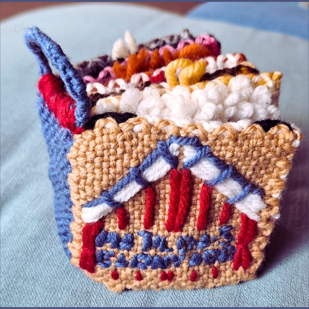 hand woven soft book for a child with a barn and child's name on the front