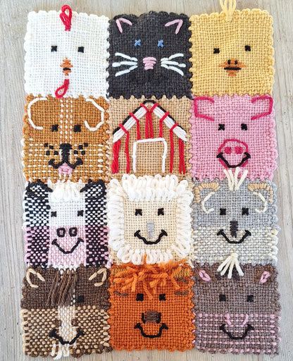 Banner of woven animal faces including chicken, cat, duckling, dog, barn, pig, dairy cow, sheep, goat, horse, beef cow, and donkey.