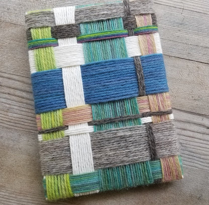 Weaving with a geometric pattern on a wooden surface