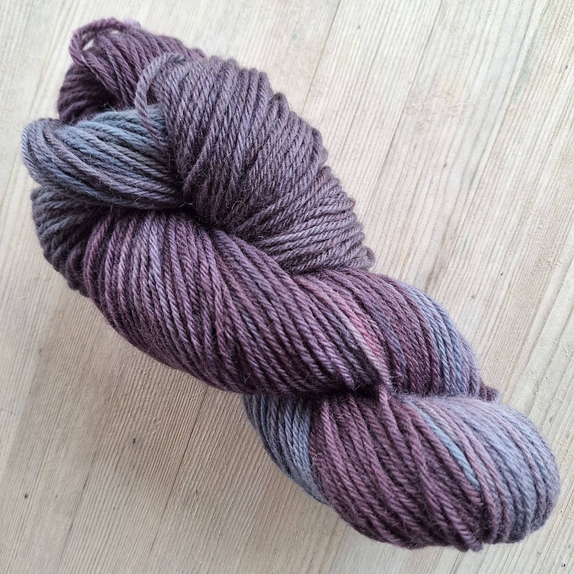 Deep purple and blue/grey yarn