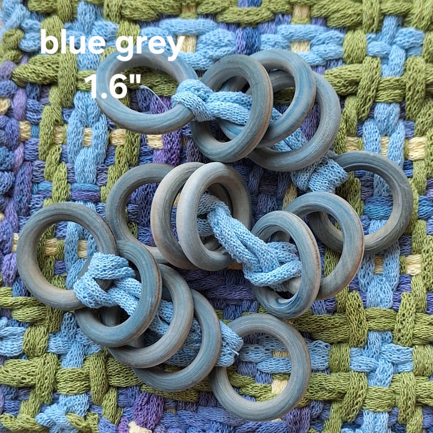 Wooden rings on a textured fabric background