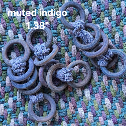 Wooden rings on a textured fabric background