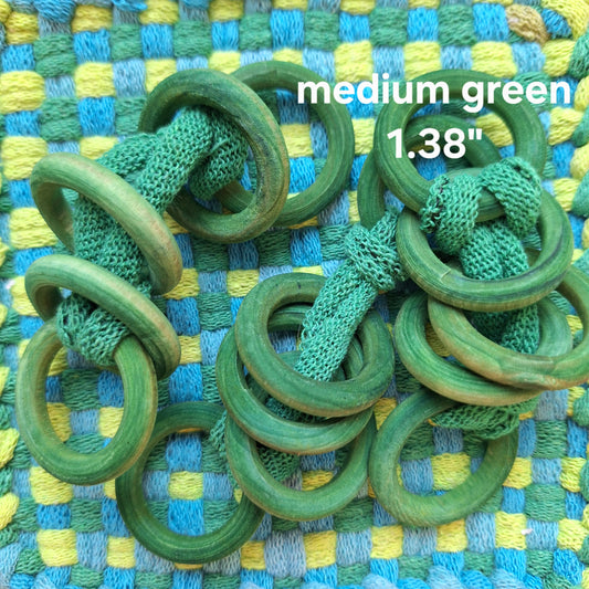 sets of green wooden potholder rings