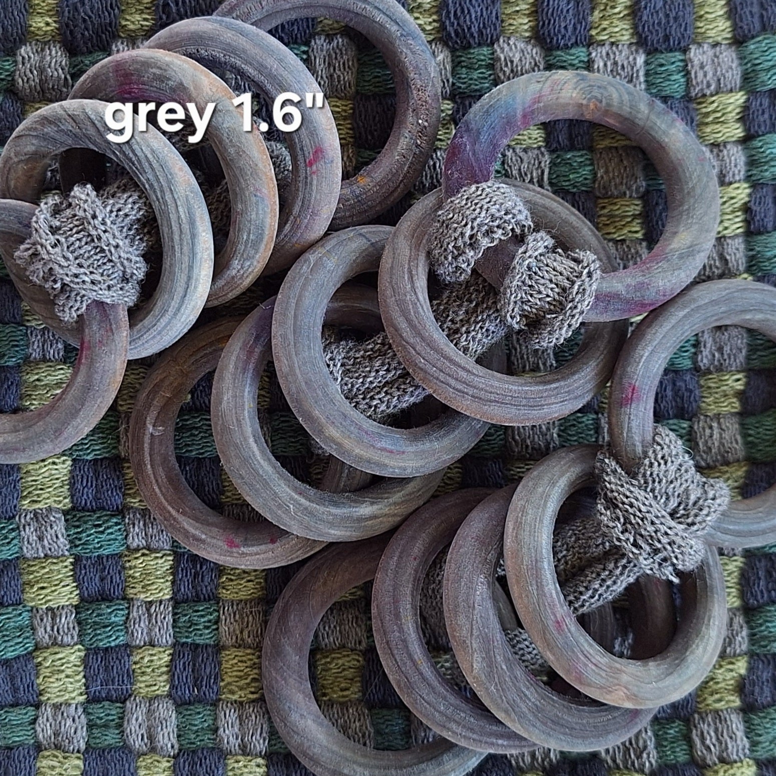 sets of grey wooden potholder rings