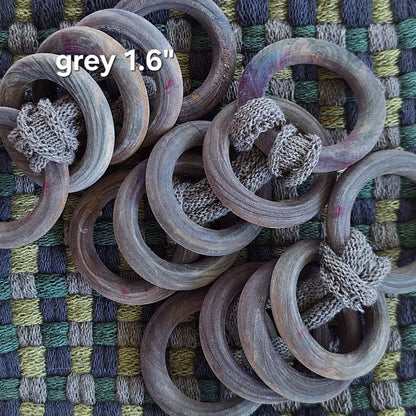 sets of grey wooden potholder rings