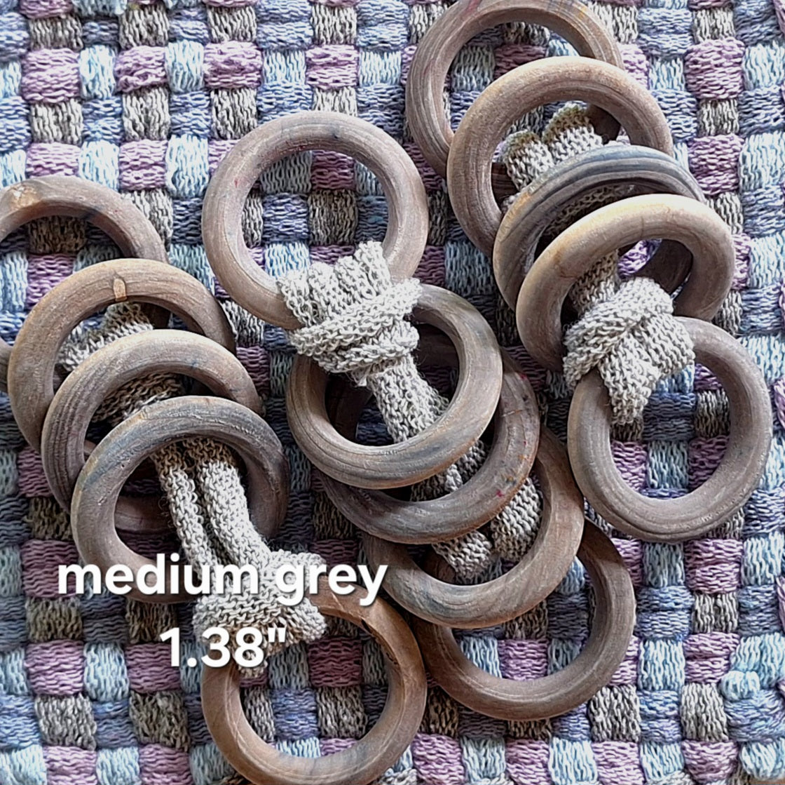 sets of grey wooden potholder rings
