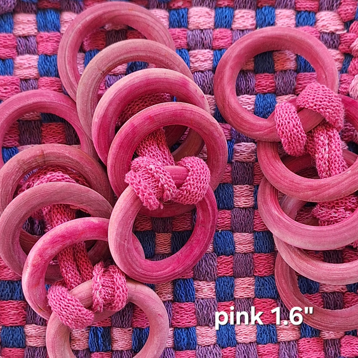 sets of pink wooden potholder rings