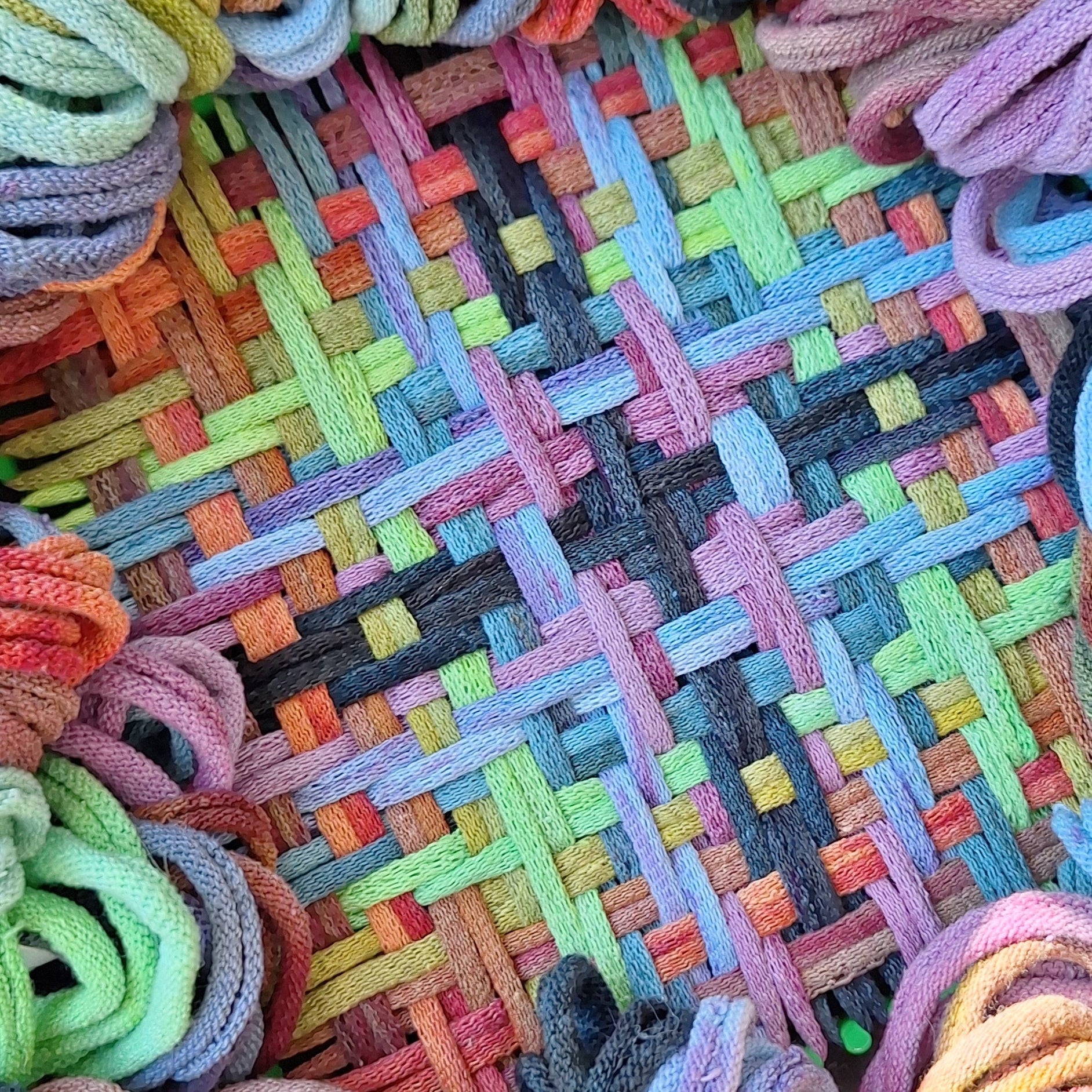Colorful woven potholder with hand dyed loops