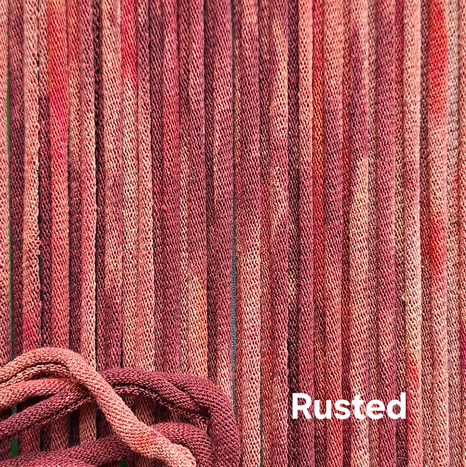 Close-up of rust-colored cotton loops with a textured pattern