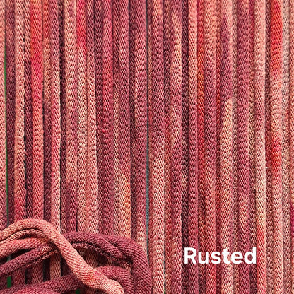Close-up of rust-colored cotton loops with a textured pattern