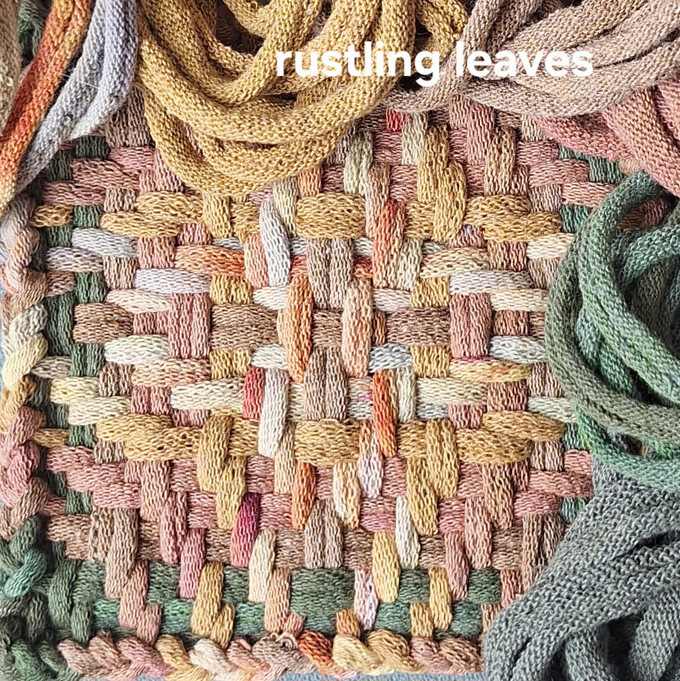 Close-up of chunky star woven potholder with 'rustling leaves' text overlay