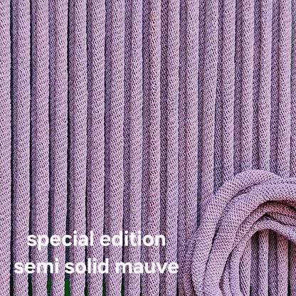 Close-up of purple potholder loops with 'special edition semi solid mauve' text.