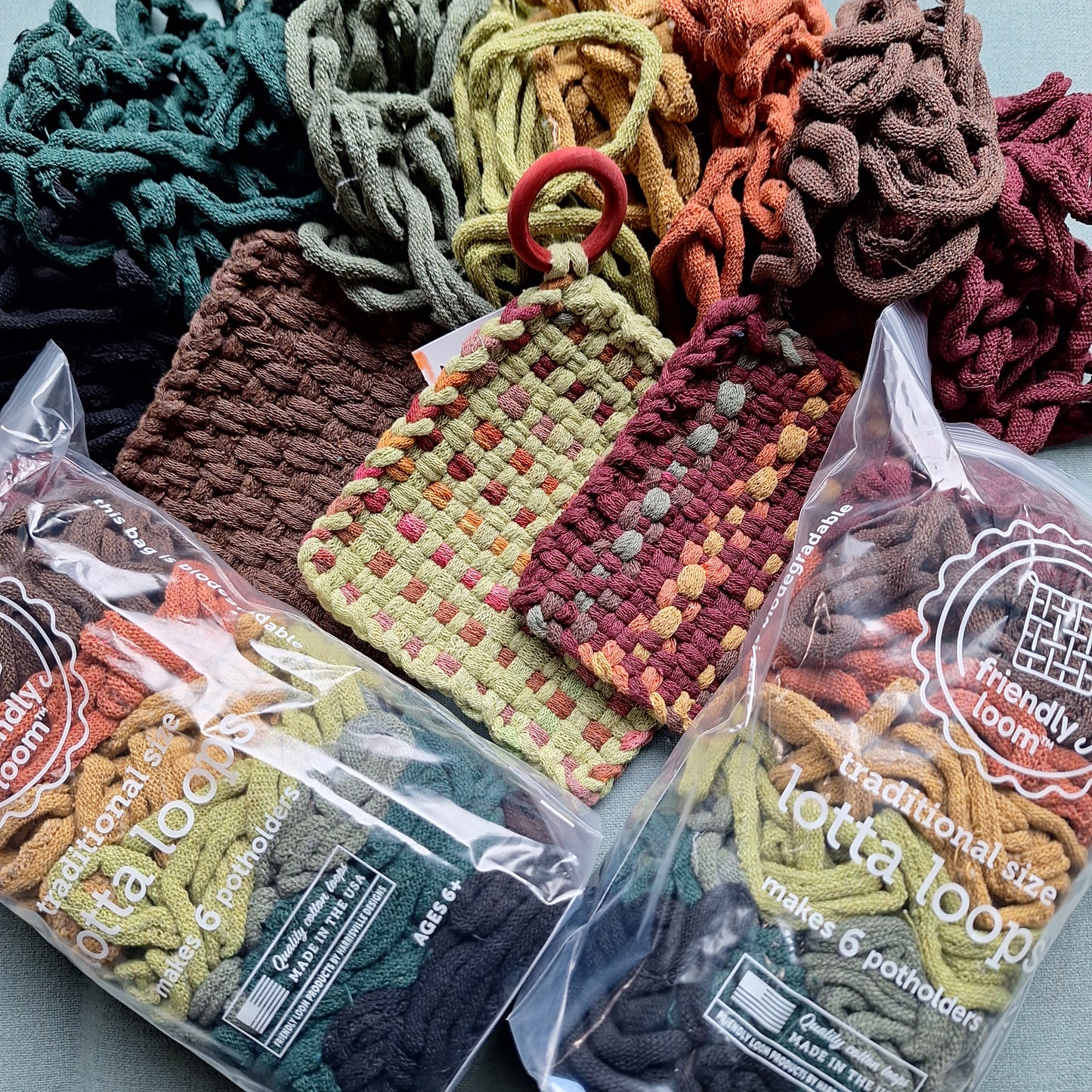 Traditional size lotta loops packs in the Earthtones colorway and sample weavings